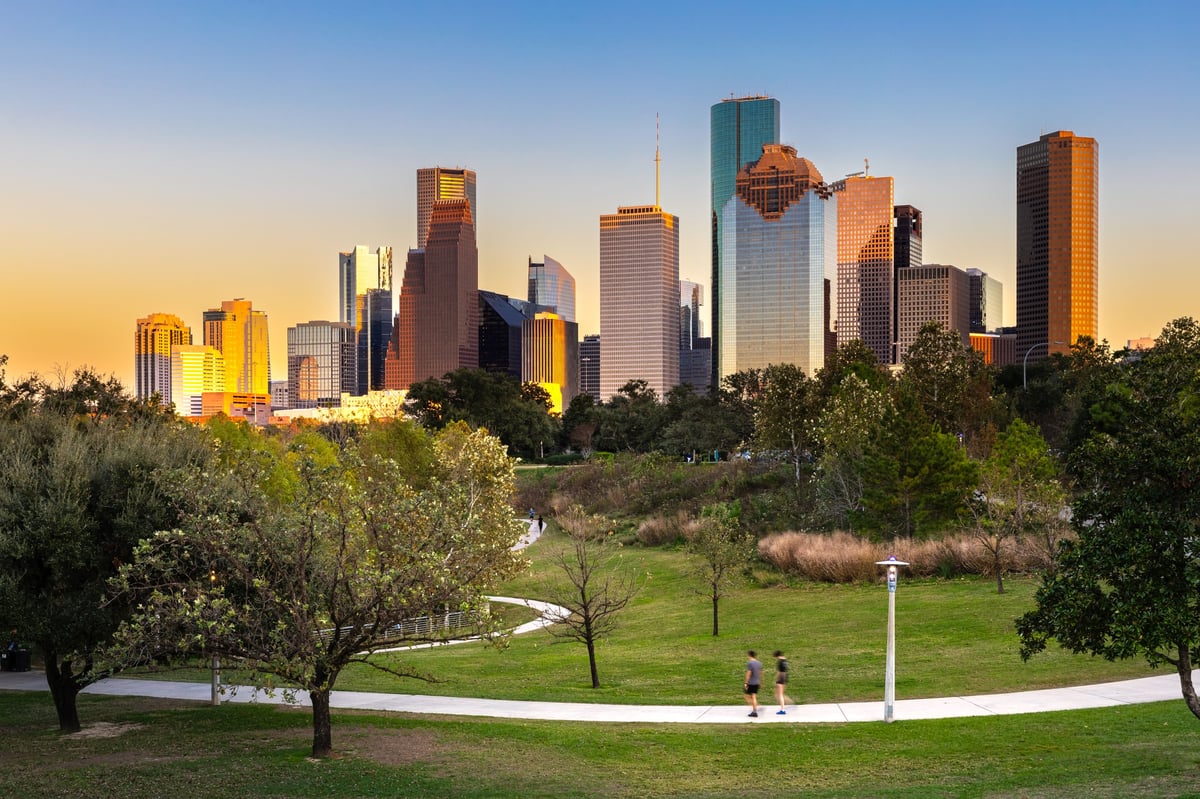 Houston downtown modern business city with skyscraper cityscape with park view from Buffalo Bayou, center of Houston, Texas, at sunset